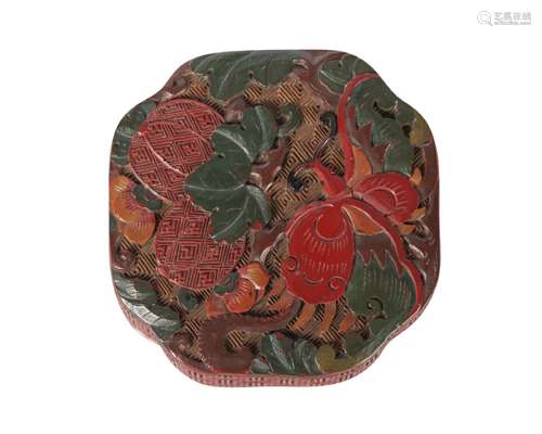 A Chinese cinnabar lacquer canted square box and cover, Qianlong period, carved to the cover with