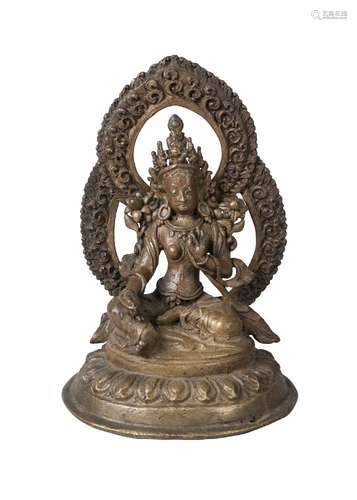 A Nepalese bronze figure of Tara, late 19th/early 20th century, seated in lalitasana, her palms