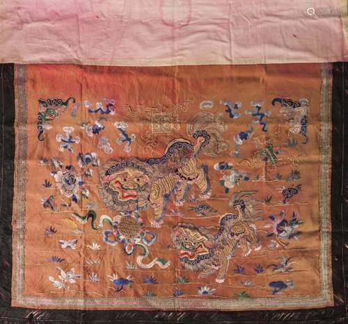 A Chinese silk embroidered altar front, 19th century, decorated with a pair of Buddhist lions on a