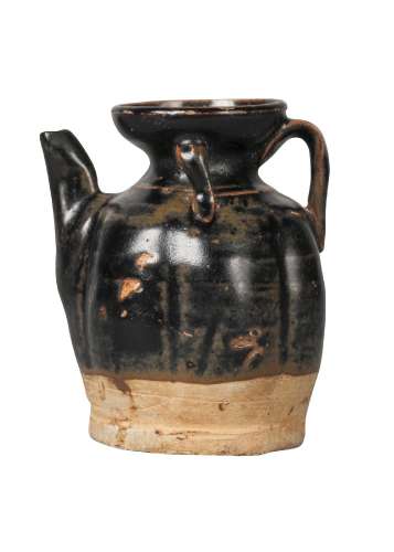 A Chinese black-glazed miniature lobed ewer, Song dynasty, with flared mouth, angular spout, loop