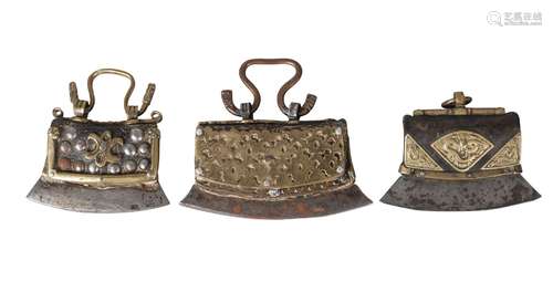 Three Tibetan brass and studded leather tinder pouches, 19th century, one with embossed brass mounts