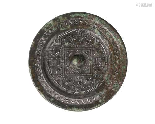 A Chinese bronze 'TVL' mirror, Han dynasty, centred with a raised knob surrounded by eight studs and