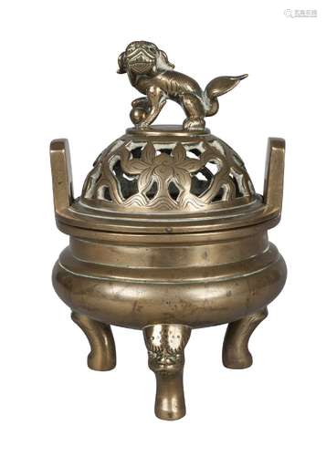 A Chinese polished bronze tripod censer, 19th century, with pierced cover decorated with lotus