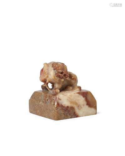 A Chinese soapstone square seal, early 19th century, carved with a seated Buddhist lion, 5.7cm wide,