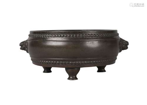 A Chinese bronze drum-shaped tripod censer, Ming dynasty, 16th/17th century, with two finely case