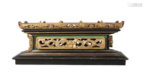 A Chinese lacquered rectangular box, late Qing dynasty, housing a carved wood stand, the case