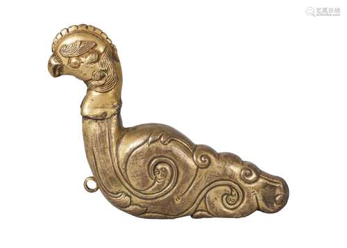 A tibetan gilt bronze repousse finial, 19th century, modelled as a phoenix, 13cm high, 17cm long