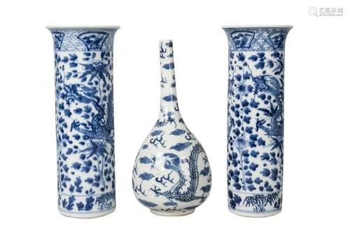 A Chinese porcelain bottle vase and a pair of sleeve vases, 19th century, the bottle vase painted