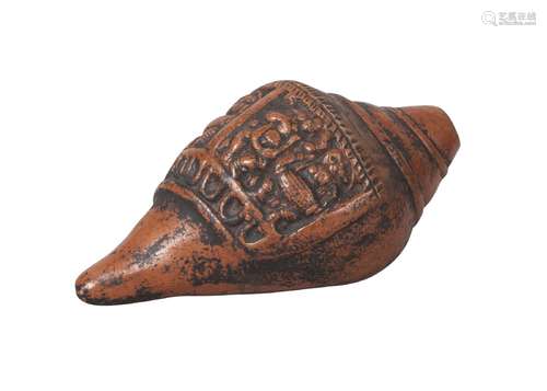 A Nepalese pottery ritual conch shell, 19th century, moulded with two panels of deities, 17cm long