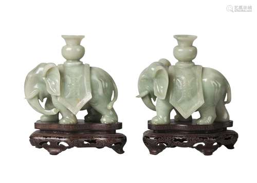 A pair of Chinese jadeite elephant candlesticks, 20th century, carved with Shou characters on