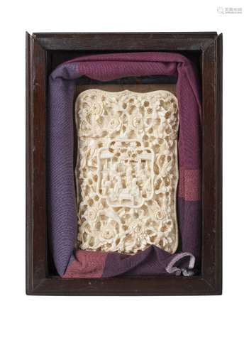 A Chinese Canton ivory card case, mid-19th century, of shaped, rectangular form, carved to both