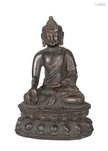 A Chinese bronze figure of Shakyamuni Buddha, Ming dynasty, 17th century, seated in dhayasana, on