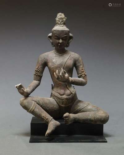 A large Nepalese clay Bodhisattva, 19th century, with right hand on knee, 38cm high