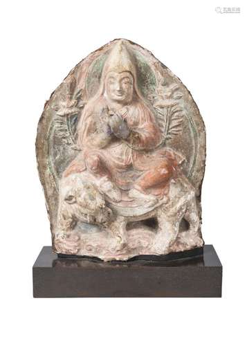 A rare Tibetan painted terracotta votive figure, 17th century, depicting lama on an elephant, with