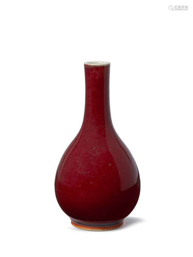 A Chinese monochrome porcelain flambe glazed bottle vase, 18th/19th century, with long narrow neck