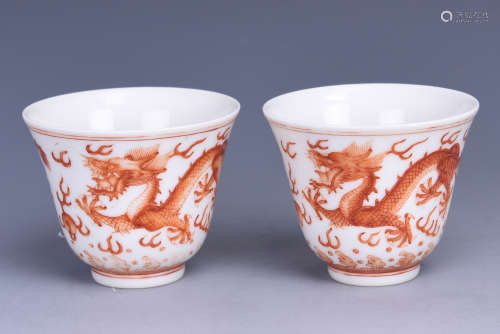 PAIR OF RED GLAZED 'DRAGON' CUPS