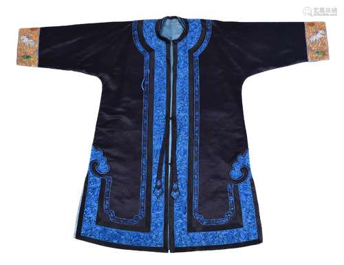 A Chinese lady’s informal robe, Qing Dynasty, 19th century, edged with brilliant blue floral