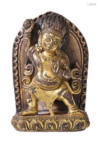 A small Tibetan gilt-bronze shrine, depicting Vajrapani, the dwarf like figure wearing a tiger