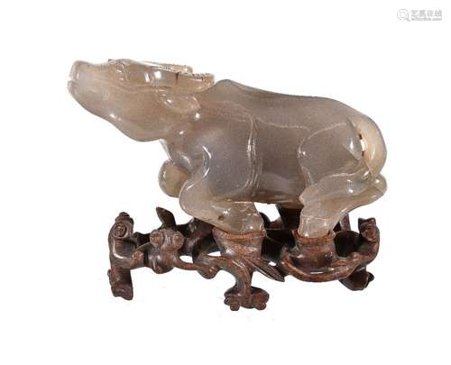 A large Chinese agate carving of a water buffalo, Qing Dynasty, standing with head raised, with