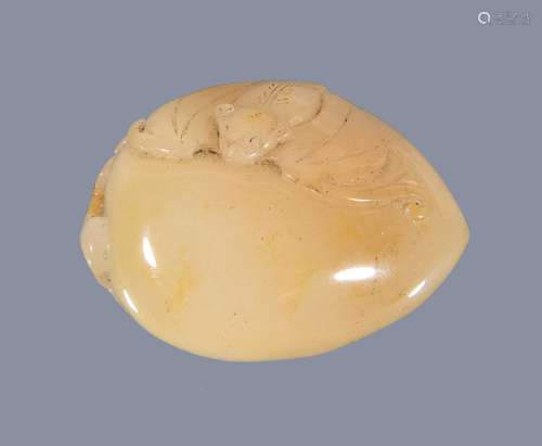 A Chinese white and brown jade ‘melon and butterfly’ carving, the three melons attached with a