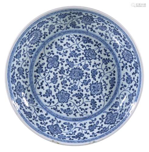 A Chinese blue and white 'Floral Scroll' Dish, Qing Dynasty, Yongzheng, in Ming-style, sturdily-