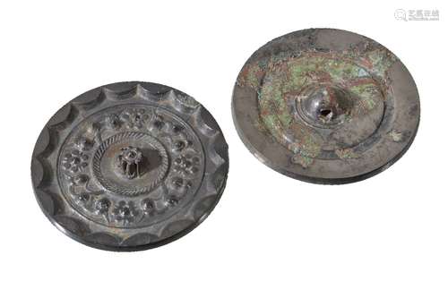 A Chinese bronze 'Star Cluster' Mirror, Han Dynasty, the recessed field of sixteen-point star