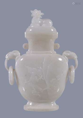 A Chinese white hardstone vase and cover, probably circa 1900-1930, the flattened ovoid body carve