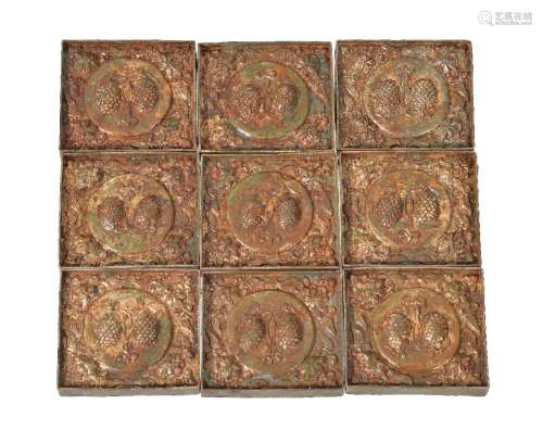 A set of Chinese gilt-copper belt plaques, crisply moulded with double central motifs surrounded