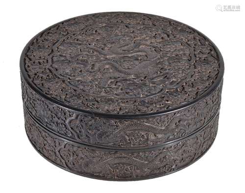 A Chinese hardwood 'Dragon' box and cover, possibly Zitan wood, the flat top boldly carved in high