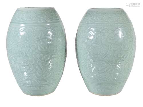 A large pair of Chinese celadon vases, Qing Dynasty, of tapering cylindrical form carved and moulded