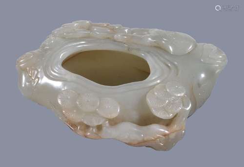 A Chinese white or pale celadon and russet jade 'pine tree' brush washer, well carved with pine