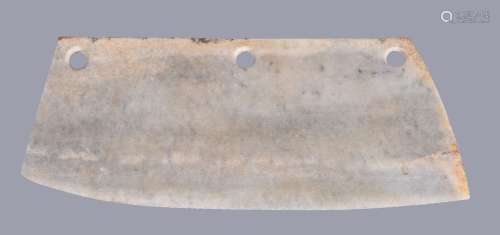 A large Chinese archaistic ceremonial jade or stone blade, with a long upper edge along its length