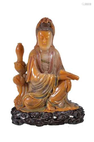 A Chinese Shoushan soapstone figure of Guanyin, Qing Dynasty, 19th century, the well carved figure