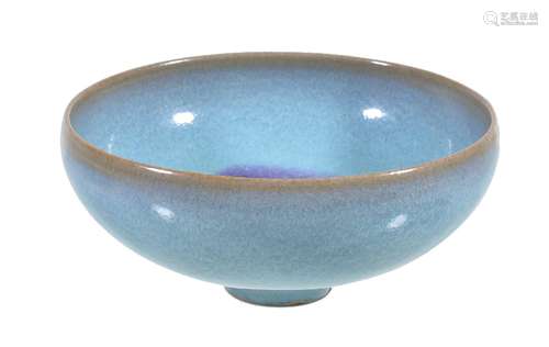 A Chinese 'Jun' type small bowl, well potted and covered in a sky-blue glaze and a crimson splash to