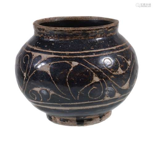 A small Chinese 'Cizhou' sgraffiato 'floral' jar, covered with a dark brown glaze, carved through