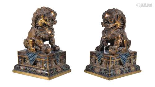 A pair of Chinese gilt-bronze Buddhist lions, with cloisonné bases, overall height 20cm and the