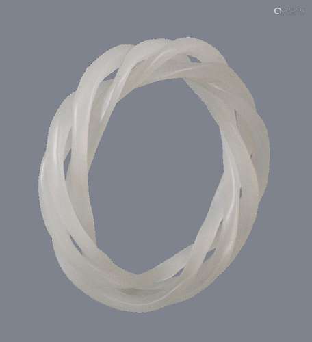 A white jade triple articulated bangle, interior measurement 6cm diameter exterior 8.5cm diameter