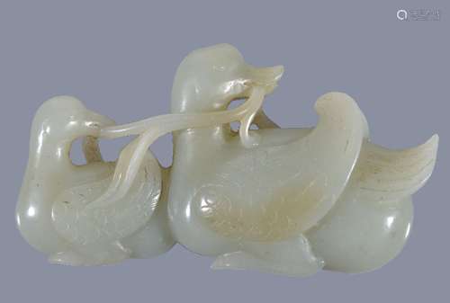 A Chinese celadon jade carving of two Mandarin ducks, Qing Dynasty, 19th century, the feathers