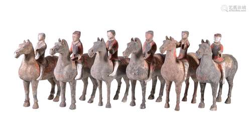 Six Chinese painted grey pottery Equestrian groups, Han Dynasty, standing four square with heads