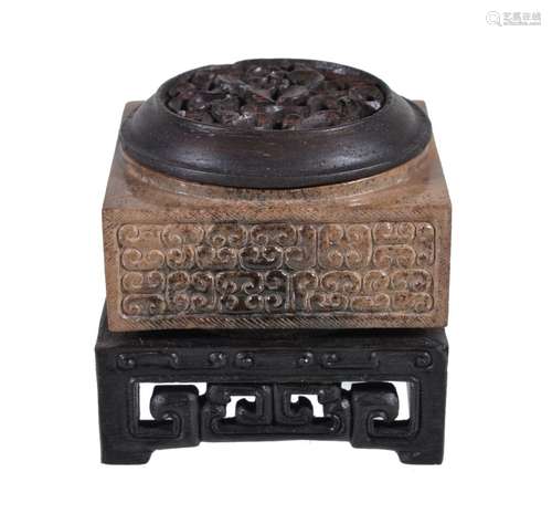 A Chinese archaistic brown and black jade cong, well carved with 'C' scrolls to each side, 5cm x