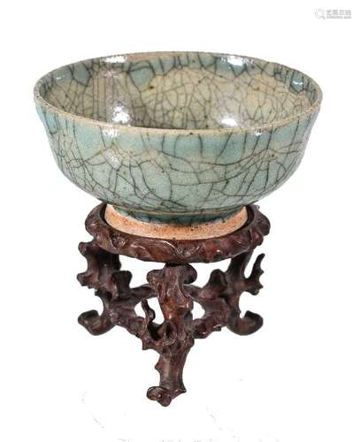 A small Chinese stoneware crackle-glazed bowl, covered overall with a glossy bluish-gray glaze