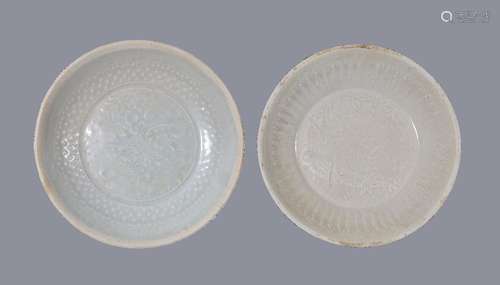 Two Chinese Qingbai moulded bowls, Southern Song Dynasty, the centres variously moulded with birds