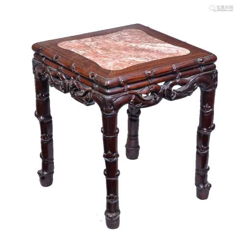 A Chinese Hardwood Stand or Table, the shaped, inset, red marble top supported on an elaborate