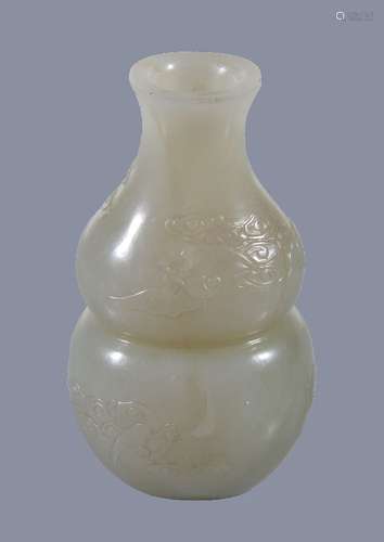 A small Chinese white or pale celadon jade 'bat and cloud' vase, of double-gourd form carved with