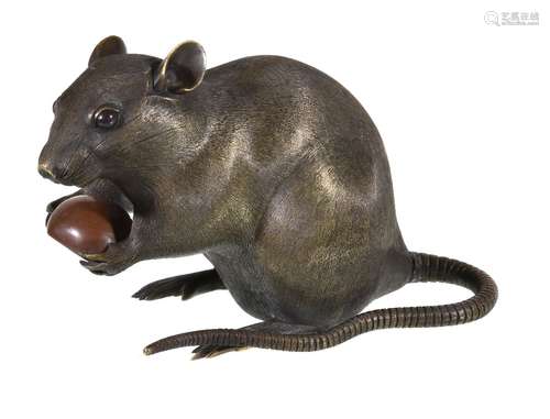 A large Chinese bronze rat, seated holding a chestnut, marked to base, 18cm long Compare with an