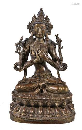 A Sino-Tibetan gilt- bronze figure of Manjusri, Qing Dynasty, China, 19th century, seated on a