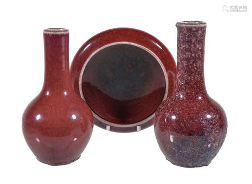 A Chinese copper-red flambé brush washer, Qing Dynasty, the streaked red glaze pooling to black in