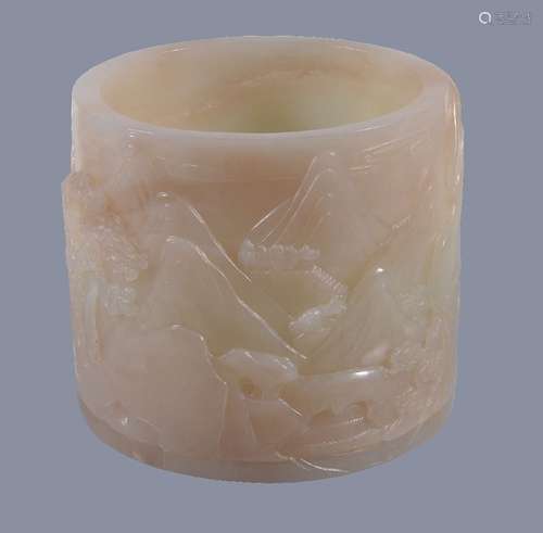 A Chinese white jade brush pot, carved with mountainous landscapes with horses and pine trees, the