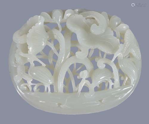 A Chinese white or pale celadon oval 'crane and lotus' plaque, worked with a tubular border