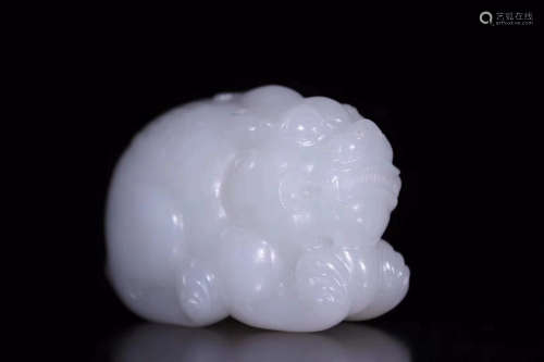 A HETIAN JADE MONSTER FIGURE